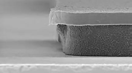 SEM showing a TechniEtch AC35 Etchant undercut at 3µm on the left to the competitor's POR at 14µm on the right.